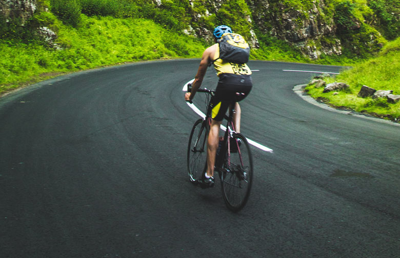 bicycle riding down a hill