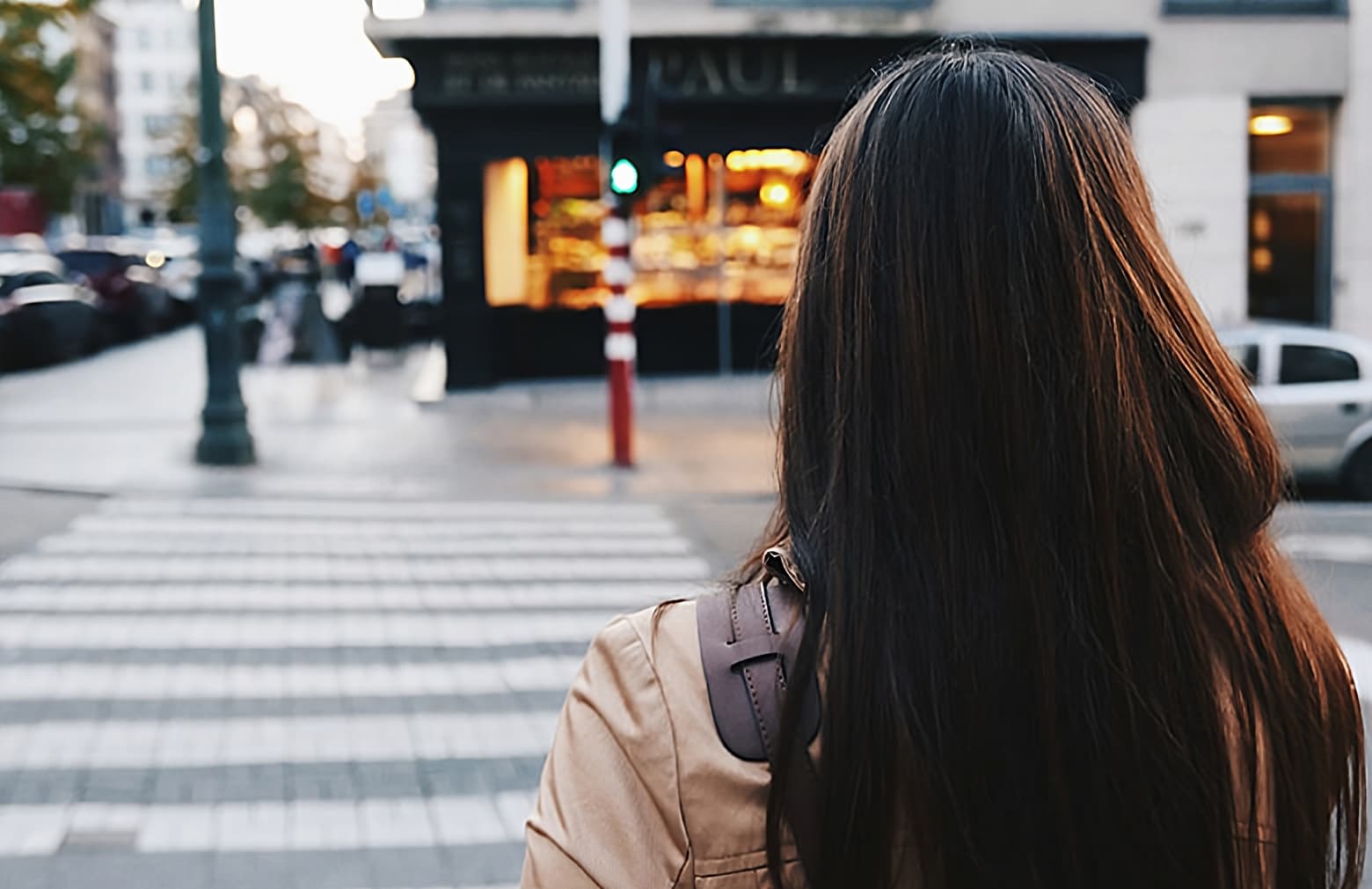 Image of a girl crossing the road on the cross walk