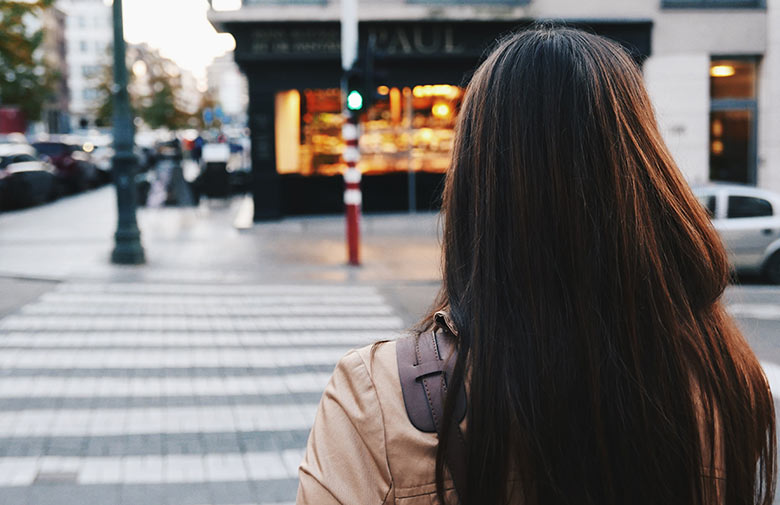 Image of a girl crossing the road on the cross walk