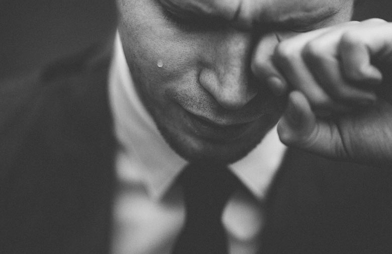 black and white image of a man crying